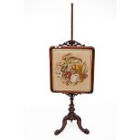 A VICTORIAN MAHOGANY TAPESTRY FIRE SCREEN, the top crested with leaf scrolls above a wool-work