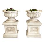 A VERY FINE PAIR OF ITALIAN STYLE SPIRAL REEDED COMPOSITION STONE URNS