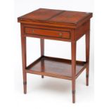 AN EBONY BANDED SATINWOOD FOLDOUT CARD TABLE OR PATIENTS TABLE, the double foldout top inlaid with