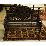 A VERY HEAVY PAIR OF BLACK CAST IRON GARDEN BENCHES, each back with an oval relief depicting a