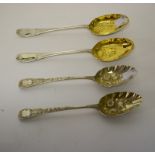 A PAIR OF GEORGE III LONDON SILVER BERRY SPOONS, each with floral bowl, c.1805; together with a pair