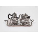 A FIVE-PIECE HEAVY SILVER-PLATED TEA AND COFFEE SERVICE