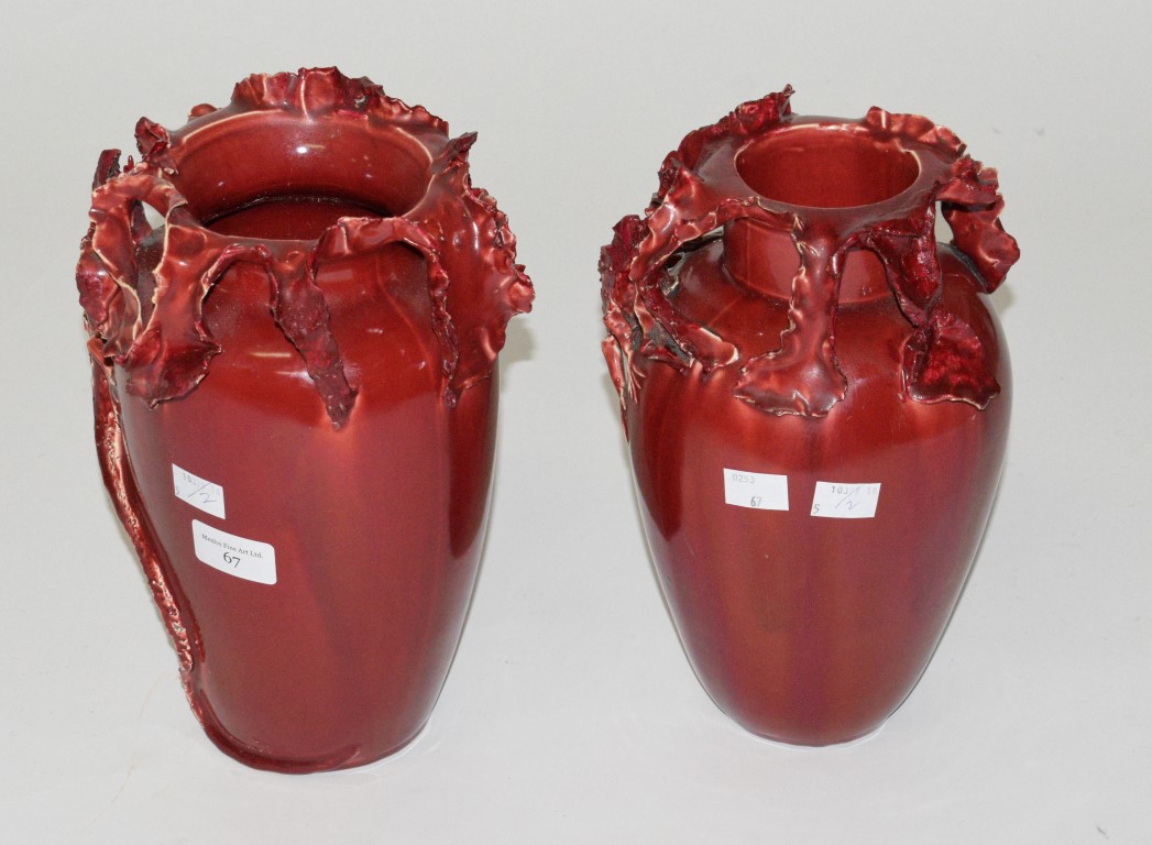 A PAIR OF 19TH CENTURY RED GROUND VODREY POTTERY GLAZED VASES, probably Frederick Vodrey of