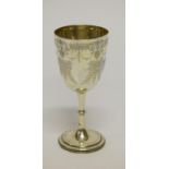 A LATE VICTORIAN SILVER WINE GOBLET, the bucket shaped bowl, bright cut and chased with flowers