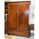 AN INLAID MAHOGANY WARDROBE, 19th century, the dentil-moulded cornice above two inlaid panelled