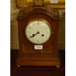 A SMALL REGENCY STYLE BRASS MOUNTED BRACKET CLOCK