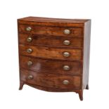 A REGENCY PERIOD MAHOGANY AND CROSS-BANDED BOW-FRONTED CHEST, with five long graduating drawers,