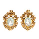 A PAIR OF ATTRACTIVE FLORENTINE CARVED GILTWOOD FRAMES, each with an oval miniature portrait of a