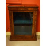 A VICTORIAN WALNUT AND MARQUETRY INLAID DISPLAY CABINET, with glazed door and raised on a two