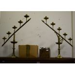 A PAIR OF FIVE LIGHT BRASS GOTHIC STYLE CANDELABRA
