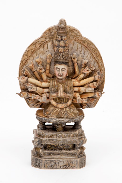 A CARVED SOAPSTONE FIGURE OF THE BUDDHA, seated on a two-tier stand, with many hands, supported by - Image 2 of 2