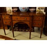 A GOOD GEORGE IV PERIOD INLAID MAHOGANY BREAK-FRONT SIDEBOARD, with rounded front corners and a