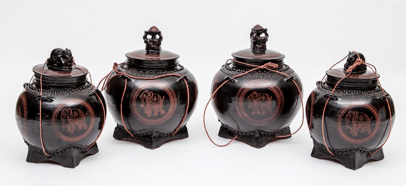 TWO PAIRS OF THAI PAPIER MACHE AND BLACK LACQUERED VESSELS AND COVERS, each with tri-elephant mask