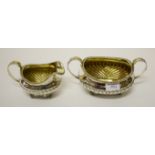 A GEORGE IV SILVER SUGAR AND CREAM, R. Pippin London 1825, the two-handled bowl with a gadroon