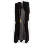 A BLACK VELVET OPERA COAT, by D.H. Evans London. (1)