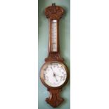 A MODERN ANEROID WHEEL BAROMETER, with thermometer, 30"(76cm) high; together with another carved oak