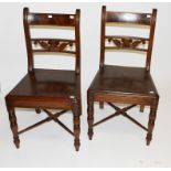 A PAIR OF 19TH CENTURY MAHOGANY SIDE CHAIRS, each with scroll uprights and leaf-carved cross rail,