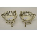 A PAIR OF PIERCED SILVER BON BON STANDS, Chester 1906, each with a basket bowl, on shaped legs,