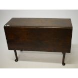 A 19TH CENTURY MAHOGANY DROP-LEAF TABLE, with rectangular flaps, raised on four tapering legs,