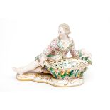 A 19TH CENTURY GERMAN FIGURAL PORCELAIN SWEET-MEAT STAND