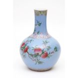 A LARGE CHINESE TURQUOISE-GROUND PORCELAIN BOTTLE VASE, decorated with pomegranates and flowering