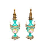 A VERY UNUSUAL AND ATTRACTIVE PAIR OF BRASS MOUNTED PORCELAIN TABLE LAMPS, 19th century, each with