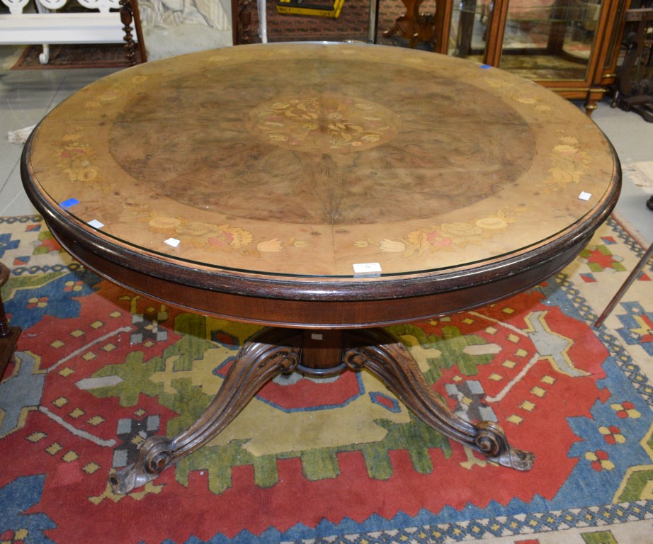 A CIRCULAR WALNUT AND MARQUETRY INLAID BREAKFAST TABLE, in the Victorian style, the moulded top with