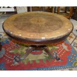 A CIRCULAR WALNUT AND MARQUETRY INLAID BREAKFAST TABLE, in the Victorian style, the moulded top with