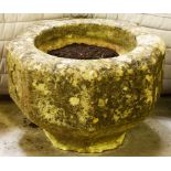 AN OCTAGONAL SHAPED SANDSTONE FOUNTAIN OR TROUGH, in the gothic style, on short tapering stem,