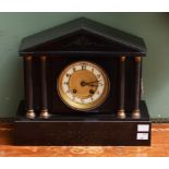 AN ARCHITECTURAL STYLE POLISHED LIMESTONE MANTEL CLOCK