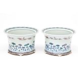 A PAIR OF UNUSUAL CHINESE PORCELAIN PLANTERS, each decorated with flying bats, above clouds and