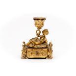 A SMALL FRENCH GILT BRONZE CHAMBER CANDLESTICK