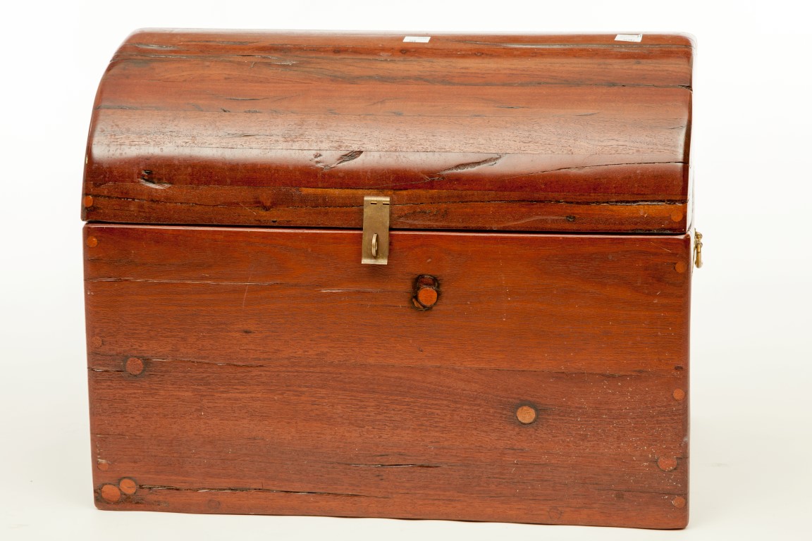 A HEAVY MAHOGANY DOME-TOP CHEST, with lift top and brass carrying handles, 24" (61cm) wide. (1)