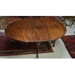 A LATE 18TH CENTURY AND LATER DROP-LEAF MAHOGANY OR RED WALNUT DINING TABLE, with demi-lune flaps,