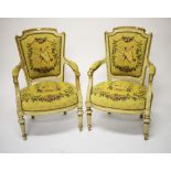 A PAIR OF FRENCH CREAM PAINTED ARMCHAIRS OR FAUTEUILS