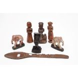 A COLLECTION OF MISCELLANEOUS CARVED WOODEN FIGURES, comprising an early figure of a woman with