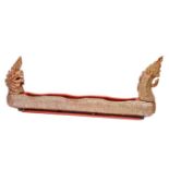 AN UNUSUAL DUG-OUT CANOE, in the form of a stylised dragon with a scaled body, in polychrome and