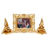 A PAIR OF FLORENTINE STYLE CARVED GILTWOOD WALL BRACKETS, each of serpentine form, on rustic