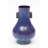 AN UNUSUAL CHINESE BALUSTER-SHAPED DARK BLUE VASE, with burgundy streaks and applied with two