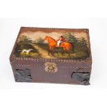 A DECORATED AND METAL-BOUND LACQUERED TRUNK, the top decorated with huntsman on horseback and hound,