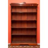 AN OPEN MAHOGANY WATERFALL BOOKCASE, early 20th century, the moulded cornice above four adjustable