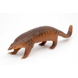 TAXIDERMY: A STUFFED ARMADILLO, standing on all fours, 32" (81cm). (1)