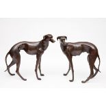 A GOOD PAIR OF BRONZE GREYHOUNDS, naturally formed, both in standing position, one looking left, the