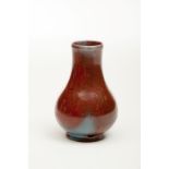 A TREACLE-GLAZED IRON RED AND BLUE PEAR-SHAPED VASE