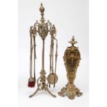 A TALL BRASS FIRE TIDY