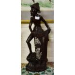 A BALINESE CARVED HARDWOOD FIGURE