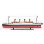 A GOOD SCALE PAINTED WOODEN MODEL OF THE TITANIC,