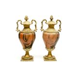 A PAIR OF HEAVY ROUGE AND DARK MARBLE BRASS-MOUNTED URNS