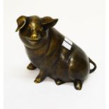 A BRONZE STUDY OF A SEATED PIG