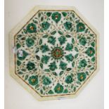 AN OCTAGONAL MARBLE TABLE TOP